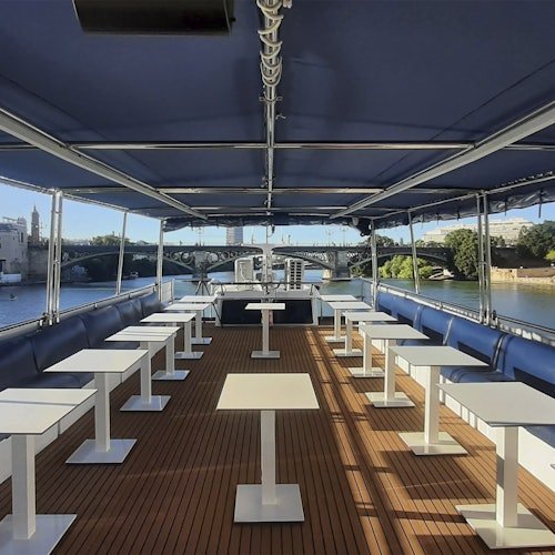 Sevilla: Paseo en barco + Comida o Cena de 5 platos + Bebidas ilimitadas